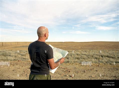 Lost Man Looking At Map In The Desert Stock Photo Alamy