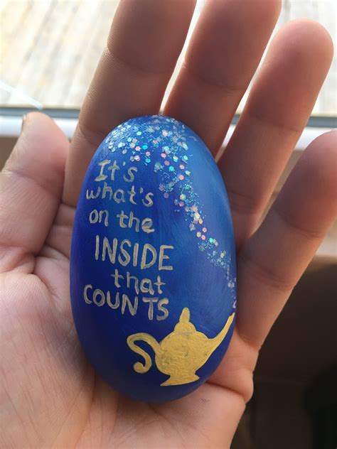 Painted rocks give unique accents to creative garden designs. Painted Rocks Ideas to Help Spread Your Kindness