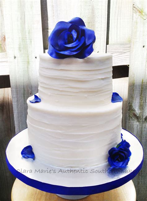 Textured Buttercream Cake With Royal Blue Roses And Petals Royal