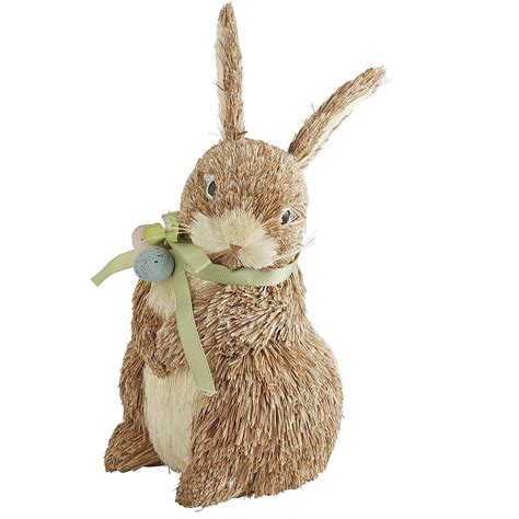 A Stuffed Rabbit With A Green Ribbon Around Its Neck