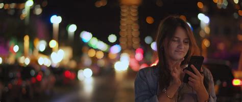 Woman Taking Selfies In City At Night Bokeh By Monster Filmmakers Royalty Free Stock Footage