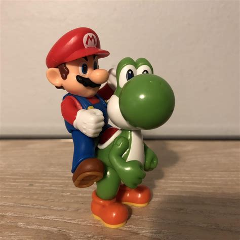Mario Riding Yoshi Rworldofnintendo