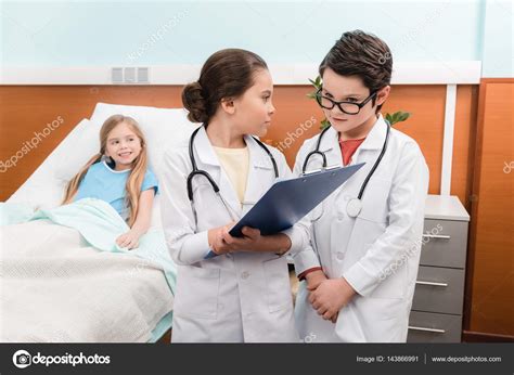 Kids Playing Doctors And Patient — Stock Photo © Zaramuzafarova 143866991