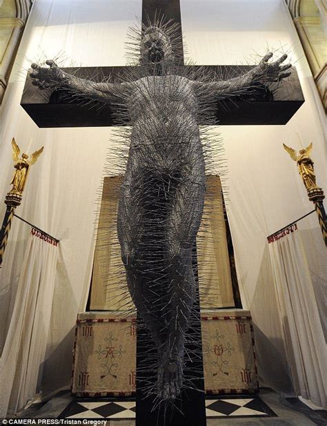 A Sculpture Of Jesus On The Cross Made Entirely From Wire Coat Hangers