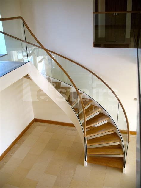 They can be built with impressive, carved and decorative railing, to serve not only as stairs, but as a piece of art. Circular staircase / wooden steps / metal frame / without ...