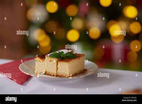 Cheesecake Decorated With A Mint Leaf Stock Photo Alamy