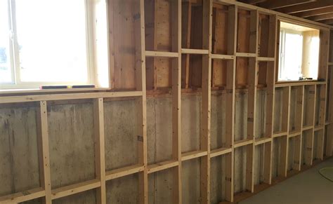 The walls can be framed and dry walled or you can stain the concrete foundation to make it look more attractive. Basement Wall Framing & Insulating | Framing basement walls, Basement remodel diy, Basement walls