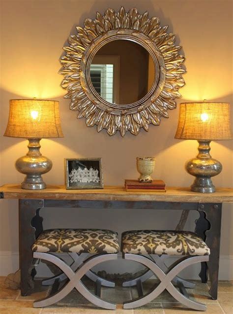You could try this with a trio of candles or vases. Create Impact with Console Tables in the Entry | Artisan ...