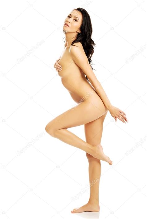 Side View Nude Woman Standing Holding Leg Up Stock Photo By Piotr Marcinski
