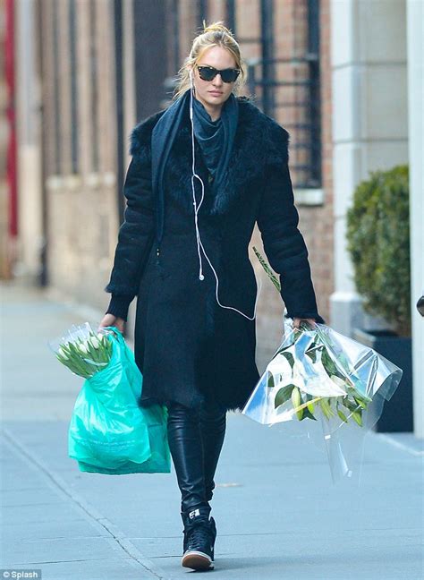 Candice Swanepoel Longs For The Beach As She Picks Up Flowers In