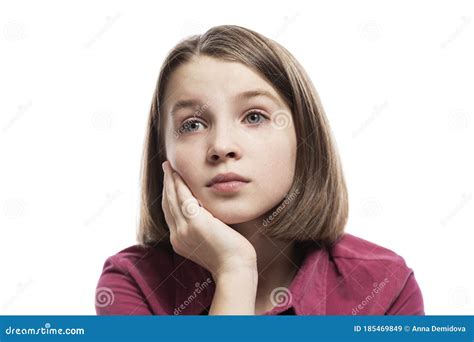 Pensive Teenage Girl Sitting Propping Her Head On Her Hand Close Up