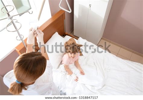 Doctor Adjusting Intravenous Drip Little Child Stock Photo 1318847117