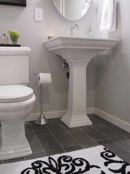 White is anything but ordinary in this bathroom. white bath dark floor