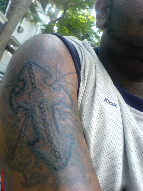 From small and simple to complex, and from black and white to colorful, you will get inspiration from the tattoo pictures below! File:Cross tattoo on arm.jpg