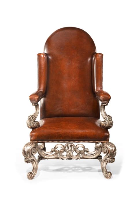 We have huge selection of leather club chairs in excellent condition. Antique Pair of Silver Gilt Leather Upholstered Wing Chairs For Sale at 1stdibs