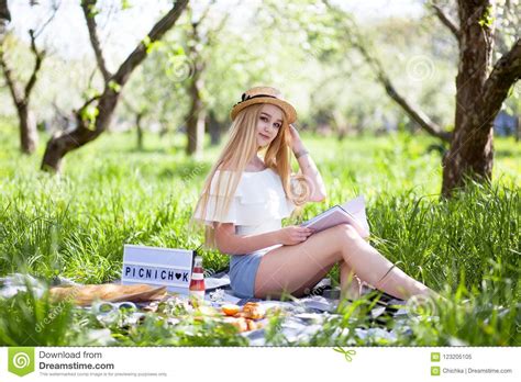 Beautiful Blonde Girl At Picnic Woman In A Straw Hat Stock Image