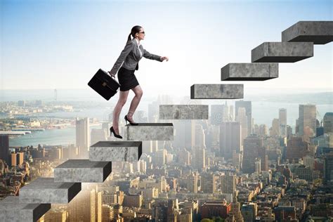 The Businesswoman Climbing Career Ladder In Business Concept Stock