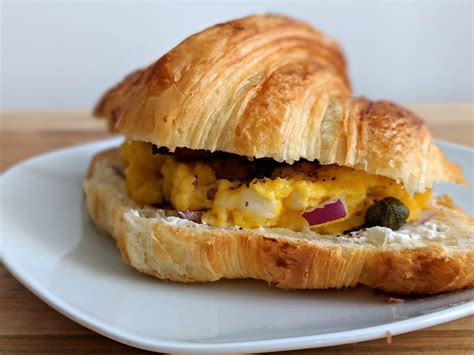 Croissant Breakfast Sandwich With Bacon And Eggs Bite Sip Savour