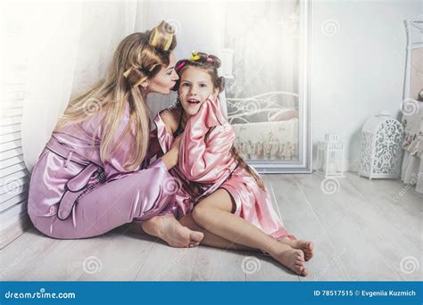 Mother And Daughter Alone At Home Beautiful Fashionable And Fun Stock