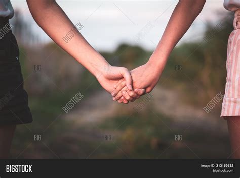Girl And Guy Holding Hands