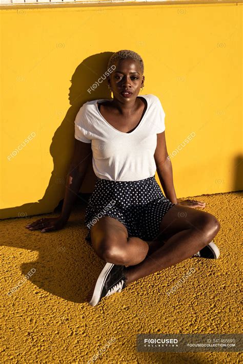 Confident Young Woman Sitting On Ground On Stadium — Beautiful From