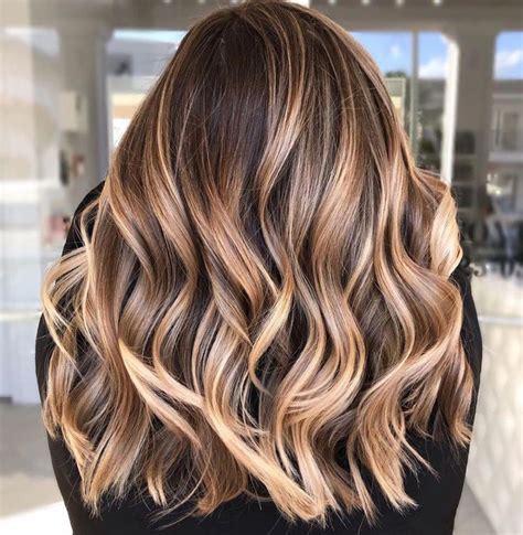 My favorite thing about warm shades on brunettes is how natural it looks. Warm Light Brown Hair with Highlights #lightbrownhair in ...