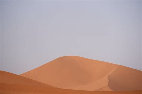 Brown Desert Under Cloudy Sky Photo Free Grey Image On Unsplash