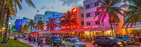 People Enjoy Palms And Art Deco Hotels At Ocean Drive Flying And Travel