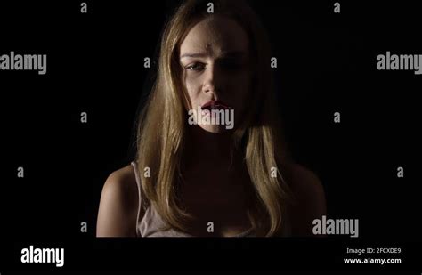 Terrified Woman On Black Background Scared Facial Expression In Horror