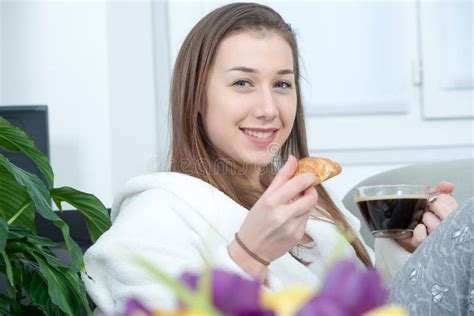 At Morning Young And Smiling Woman Drinking Orange Juice Stock Photo