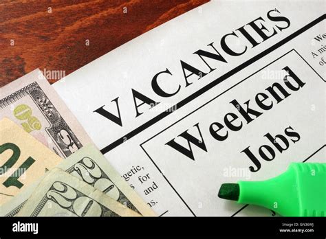 Newspaper with ads weekend jobs vacancy. Occupation concept Stock Photo