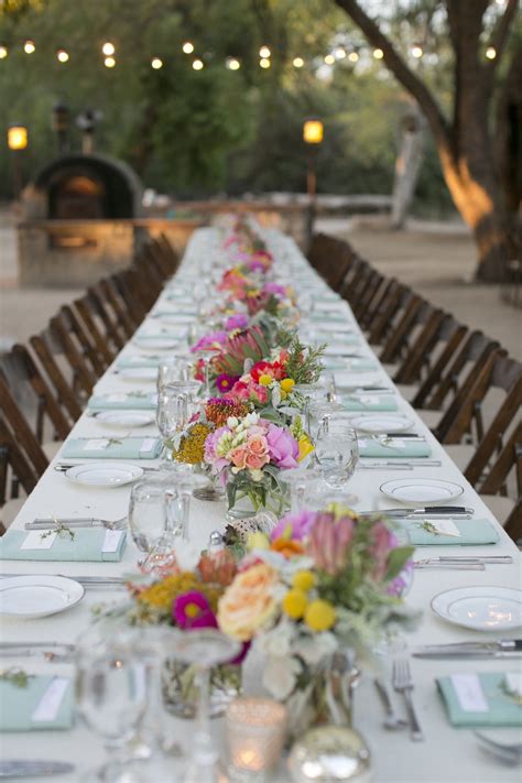 Long Tables With Bright Centerpieces Outdoor Wedding Reception