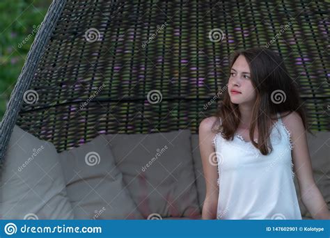 Pretty Young Woman Relaxing In A Wicker Chair Stock Image Image Of