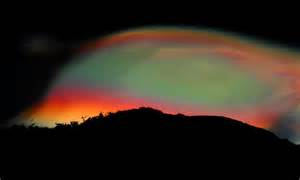 Rare Rainbow Clouds Shimmer In The Night Sky Over