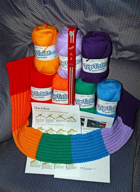 Beginner's scarf knit kit with encore worsted yarn (cranberry red). Rainbow Scarf Knitting Kit - Colin and Carole's Creations.