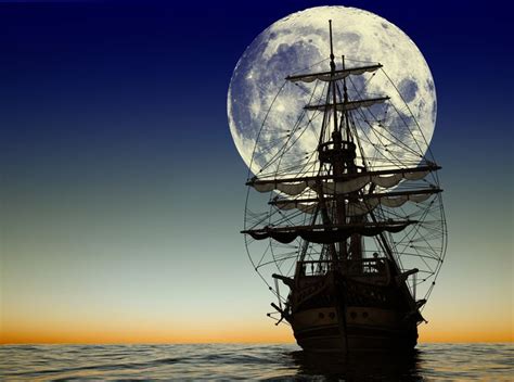An Old Sailing Ship With The Moon In The Background At Night Time Stock