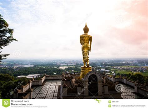 Golden Buddha Statue Standing On A Mountain At Wat Phra That Khao Noi