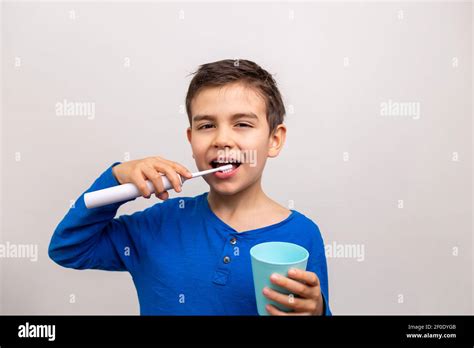Six Years Old Boy Brushing His Teeth Electric Toothbrush Stock Photo