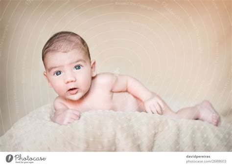 Portrait Of Newborn Baby Lying Down Over A Blanket A Royalty Free