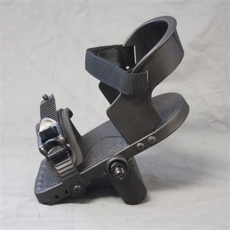 A Pair Of Black Sandals Sitting On Top Of Each Other