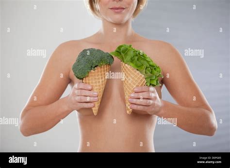Naked Woman Holding Ice Cream Cones With Lettuce And Broccoli Stock Photo Alamy