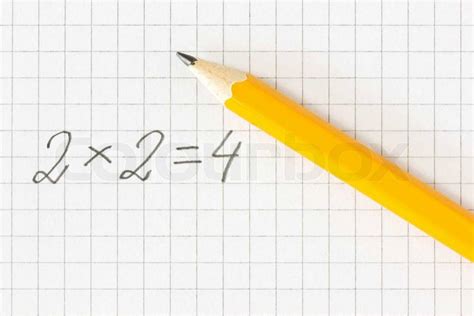 Math Formula And Pencil On Squared Paper Stock Photo