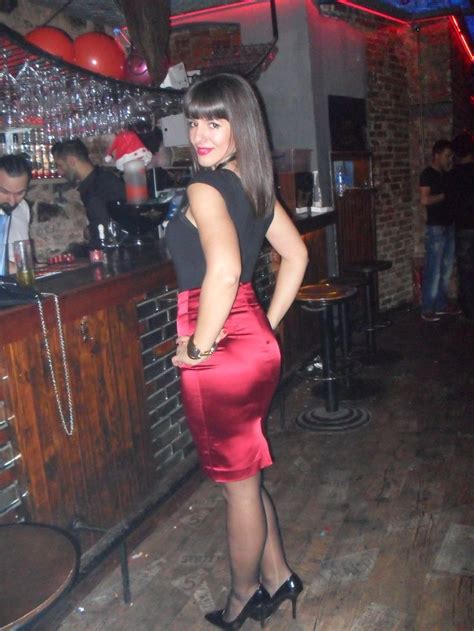 tight red satin pencil skirt black top sheer black stockings and black high heels