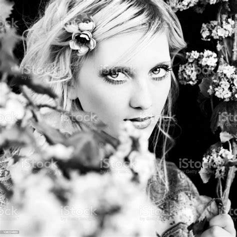 Young Woman Posing With Flowers Black And White Stock Photo Download