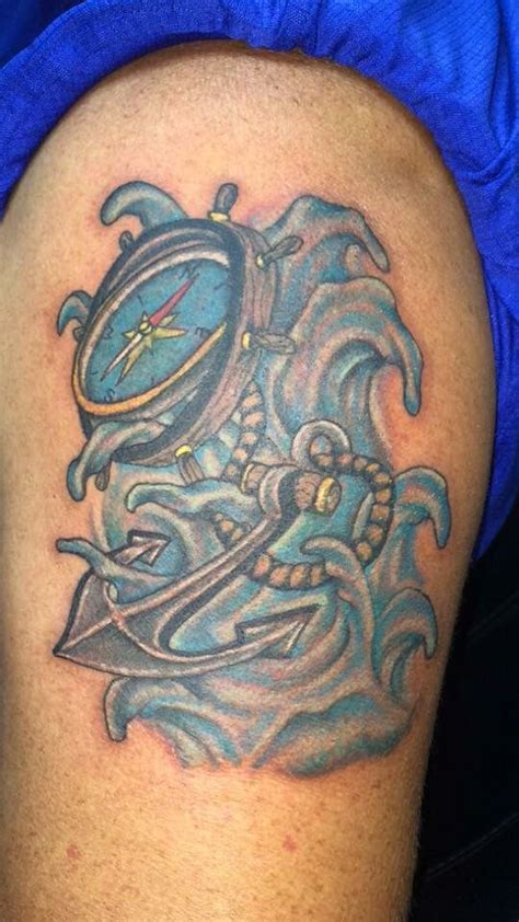 A reminder to always stay grounded and keep your wits about you. Anchor compass and wheel Tattoo done by Ricky Garza in ...