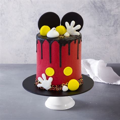 You can see how nicely the proportions of the standard round cake pan and the dollar store pans work together to make the classic mickey mouse silhouette. Mickey the Mouse Birthday Cake