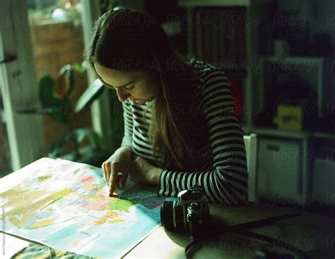 A Beautiful Woman Planning A Trip With A Map Del Colaborador De Stocksy Anna Malgina Stocksy