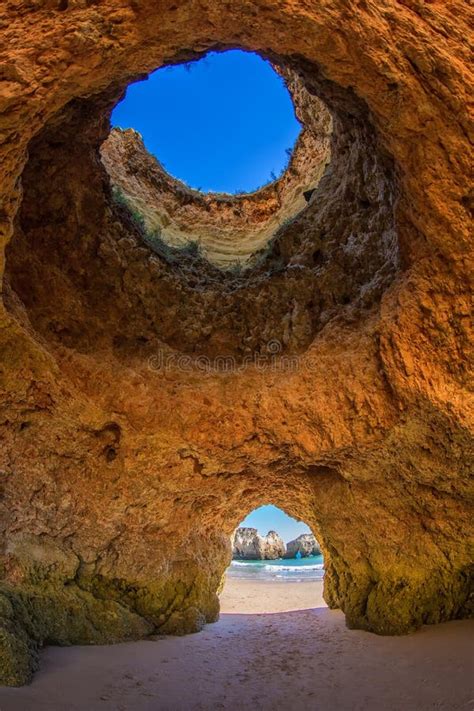 Famous Caves In A Beach Rock Formation In The Algarve Portugal