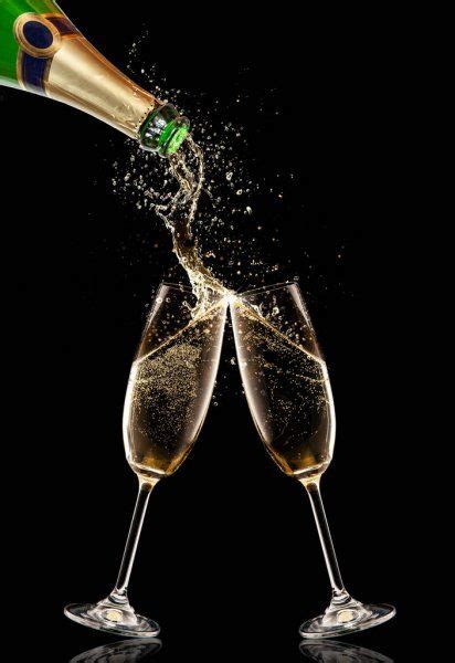 Two Glasses Of Champagne With Bottle Over Black Background — Stock