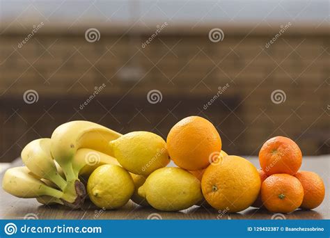Bananas Lemons Oranges And Tangerines Fruits In Warm Tones Stock
